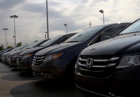 Line up of Honda cars in parking lot